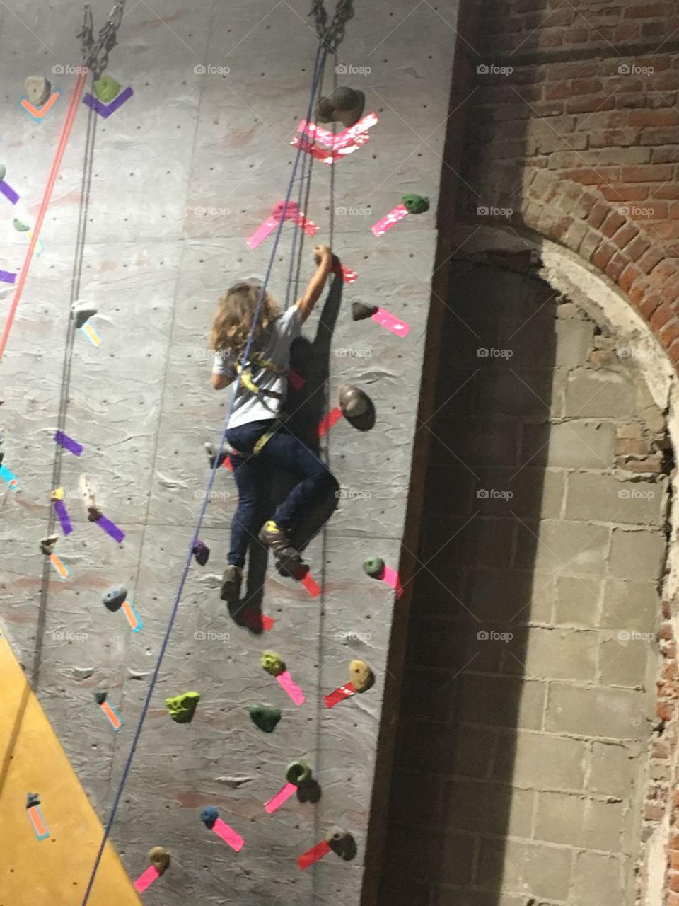 Child climbing wall