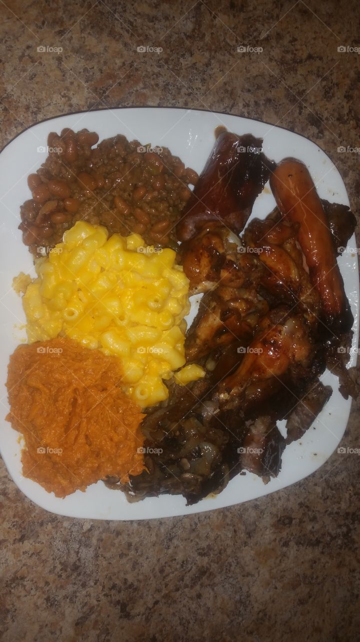whipped sweet potatoes creamy mac and cheese loaded baked beans ,sausage, hot dog ,Chicken & BBQ ribs