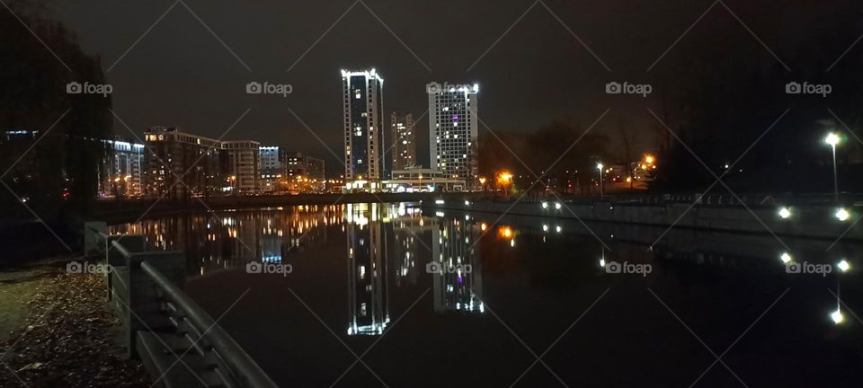 beautiful night light windows city and reflection