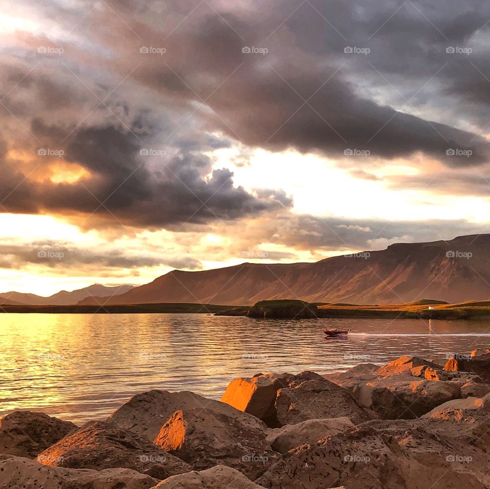 A single boat skipping on waves of golden light.  A perfect time to reflect on the end of the day.