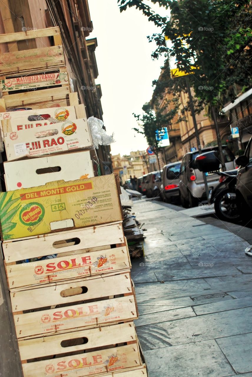 Fruit crates on sidewalk. A tower of fruit crates on a city sidewalk in Rome