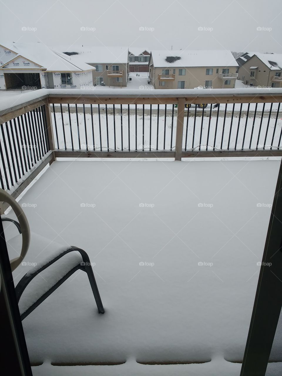 snow in March on our back deck