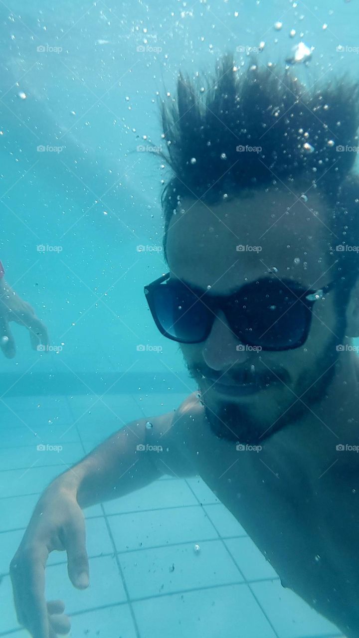 bearded boy under water