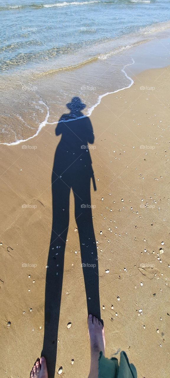Shadow of person on beach