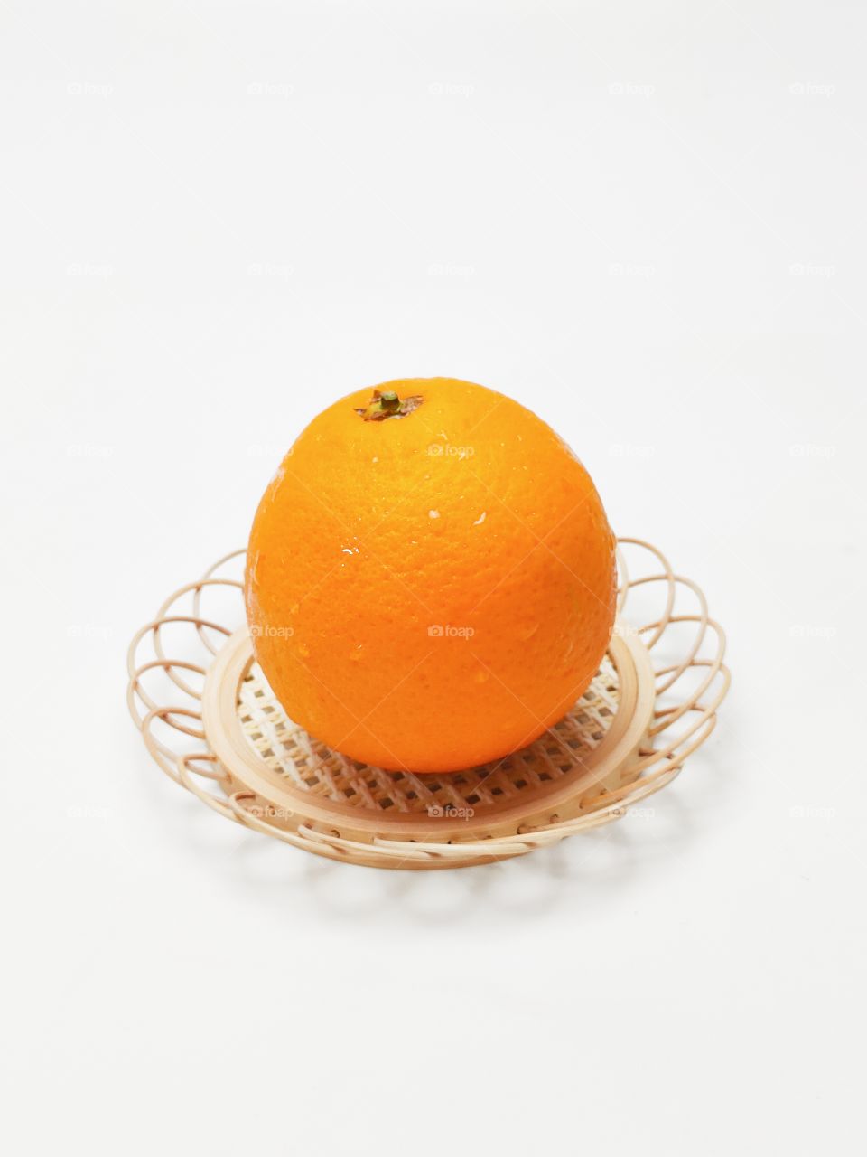 orange in wicker basket