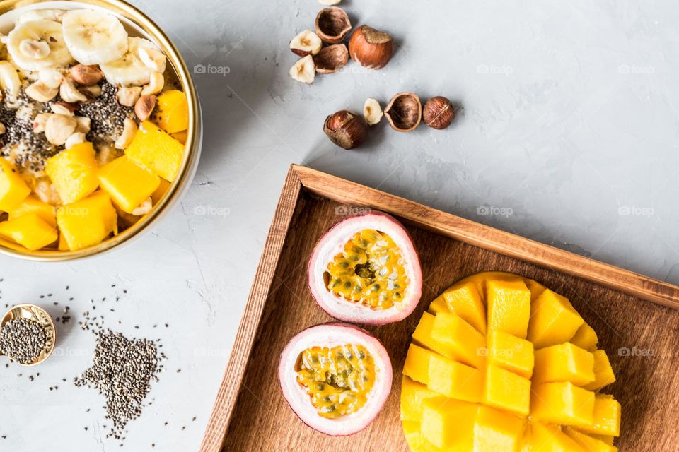 Flat lay of breakfast bowl with fresh fruits 