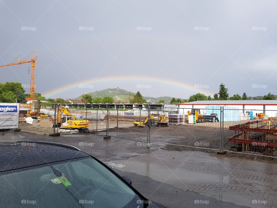 Rainbow over construction site