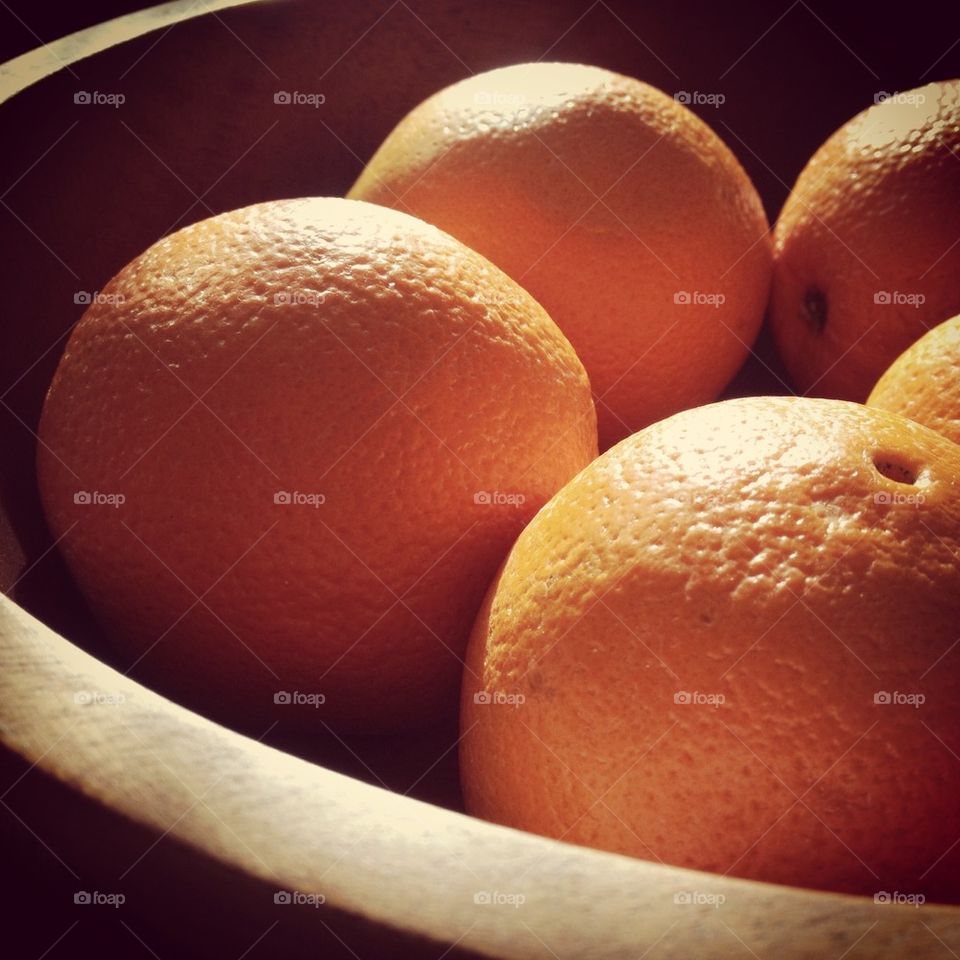 Oranges in a wooden bowl