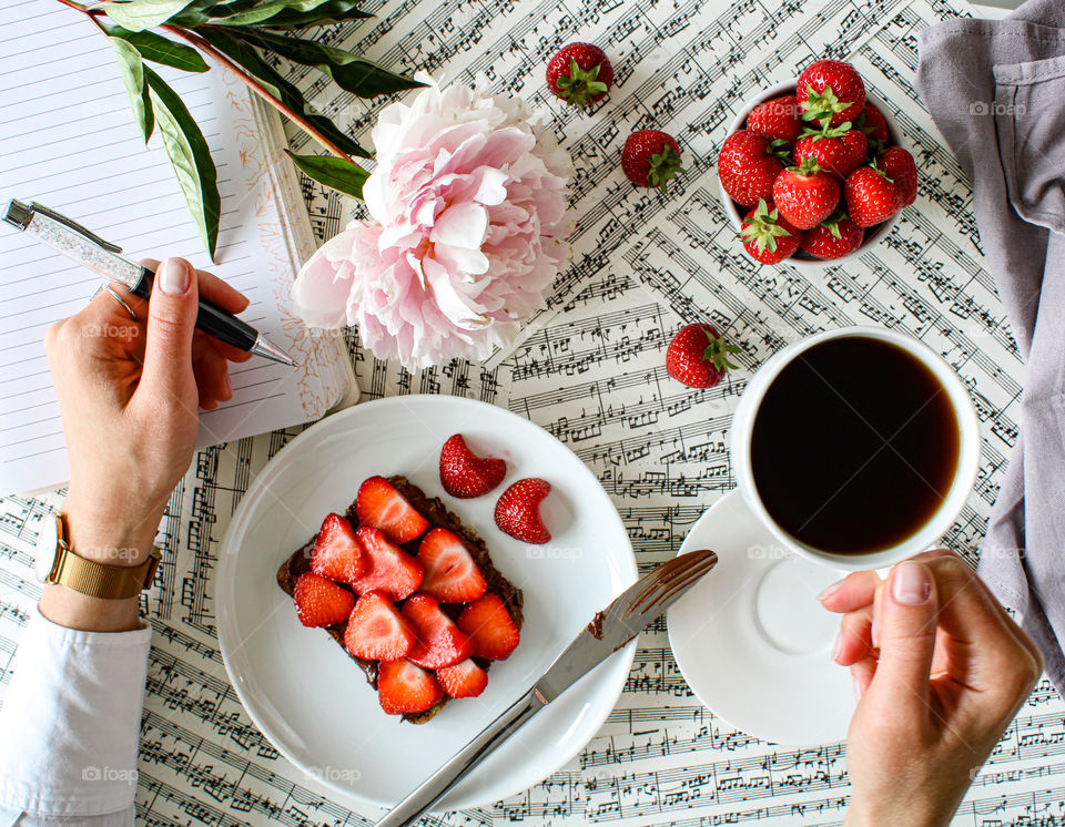 Coffee time and chocolate bread with strawberries 