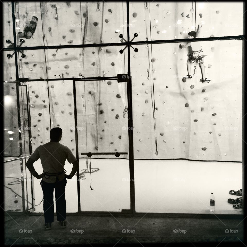 Climbing wall. Kids learning to climb