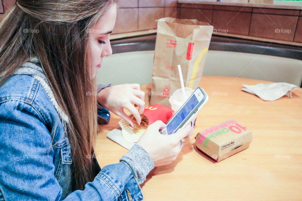 McDonald’s- girl eating at McDonald’s 