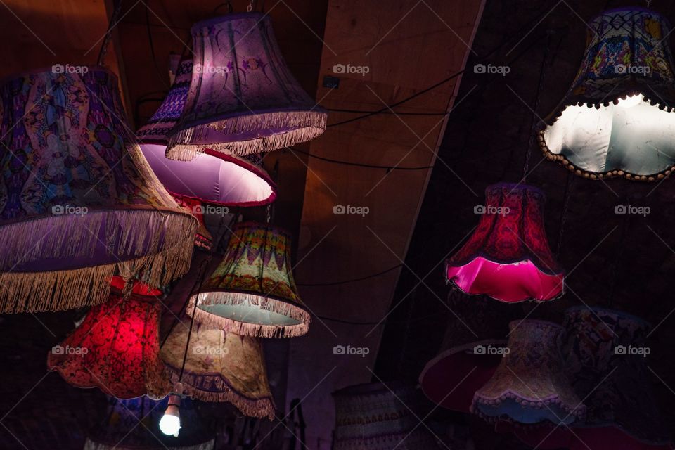 Hanging lampshades in a Camden market alley 