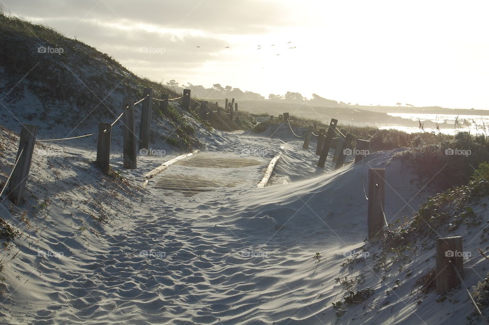 Sandy path. Sand covered path at the beach