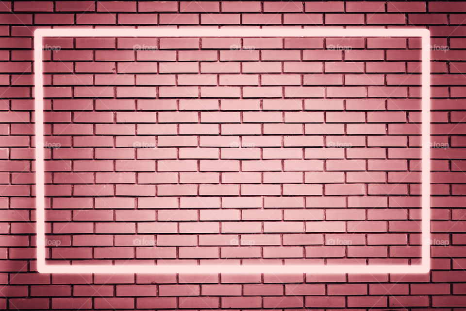 Glowing bright frame, pink vintage brick wall with space for text 