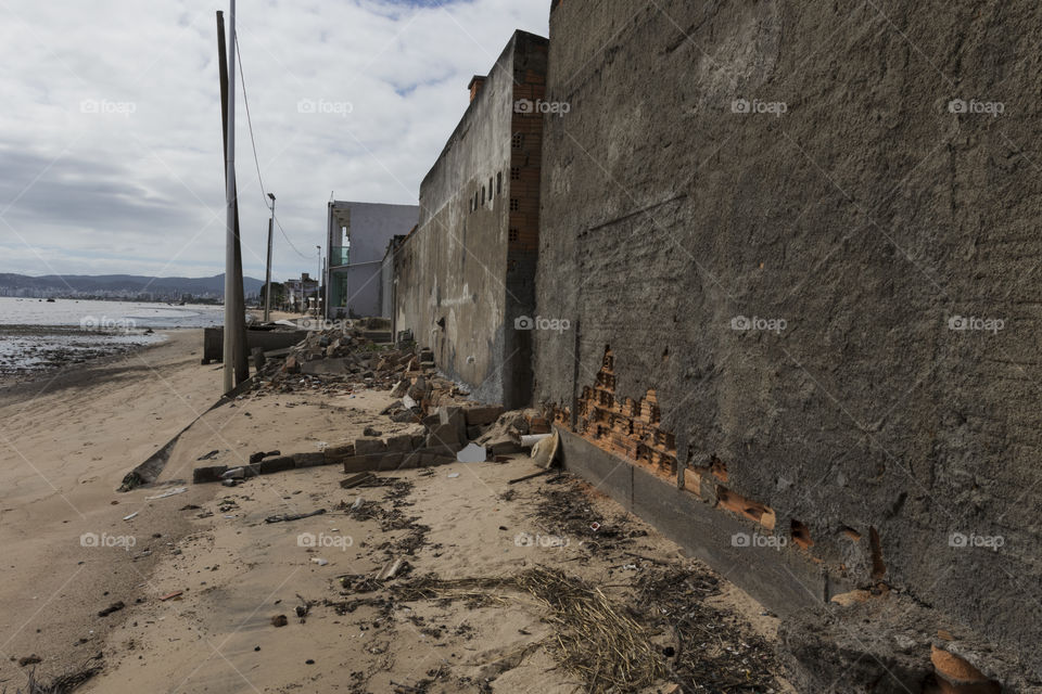 Destruction of houses by the sea