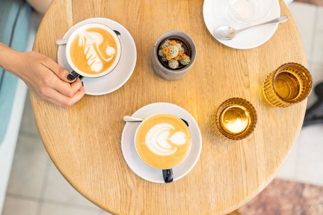 Two cups of cappuccino.