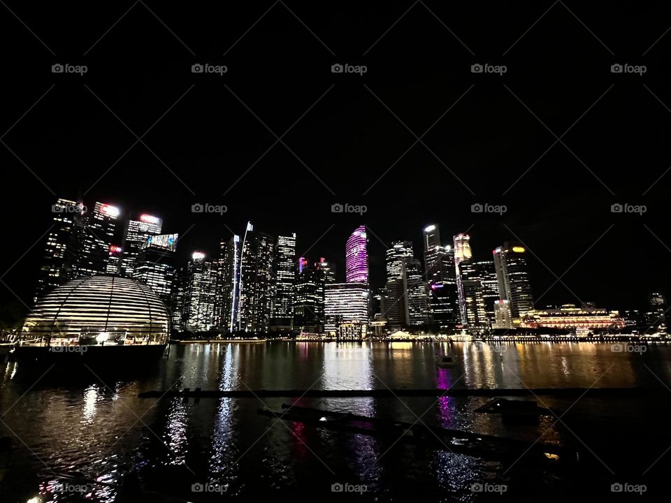 Apple Store in Singapore with night skyline 