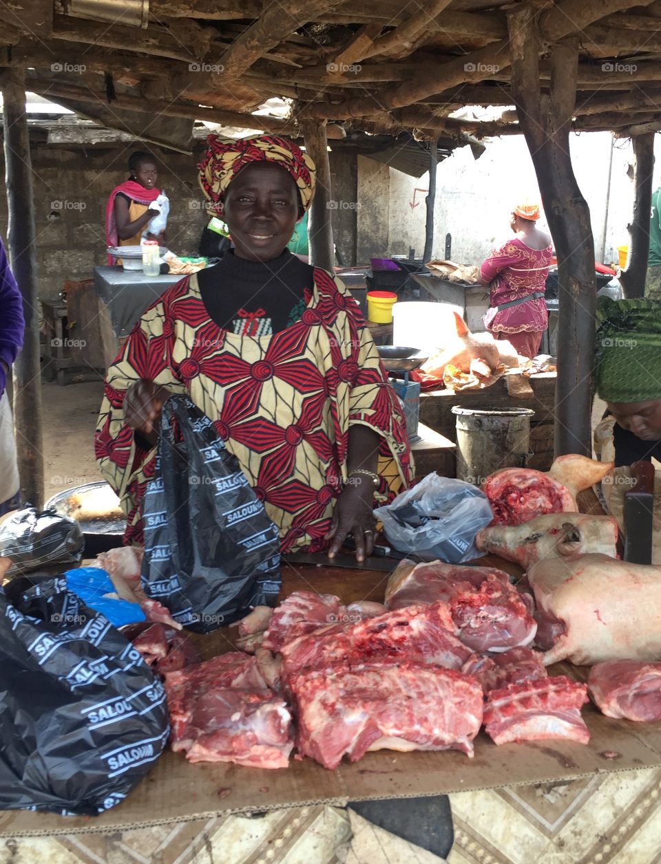 Woman standing in butcher shop