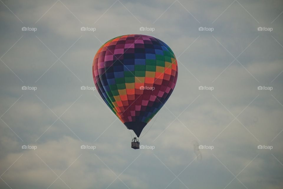 colorful balloon flies through the sky