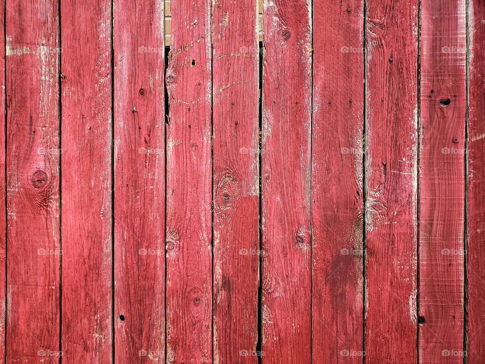 Distressed barn color red painted wood background