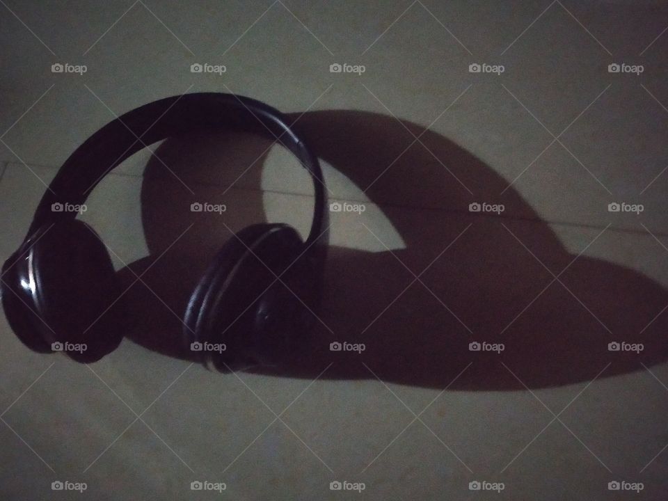 A shadow is a dark (with real image) area where light from a light source is blocked by an opaque object. It occupies all of the three-dimensional volume behind an object with light in front of it.