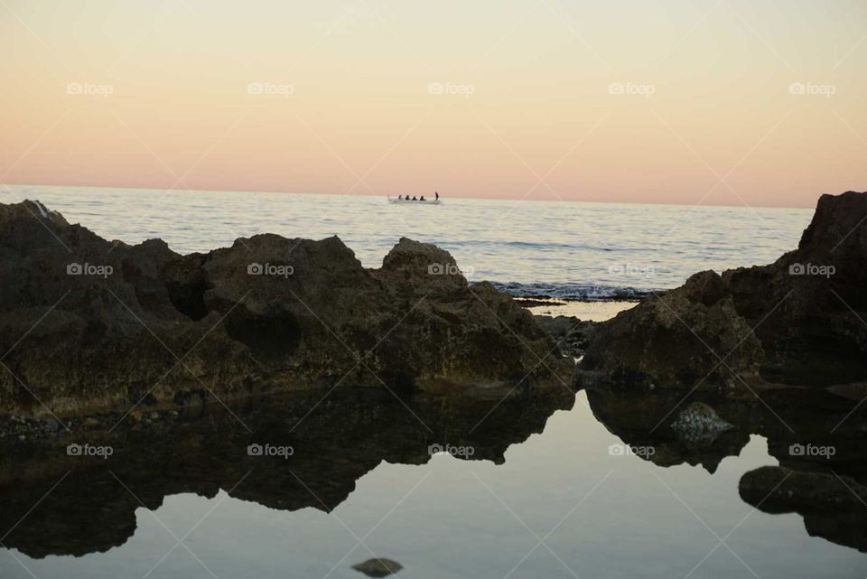 Beach#rocks#water#reflect#sunset#boat