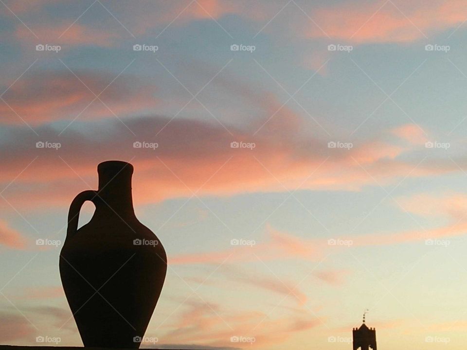 jar of water huging magic clouds in the sky.