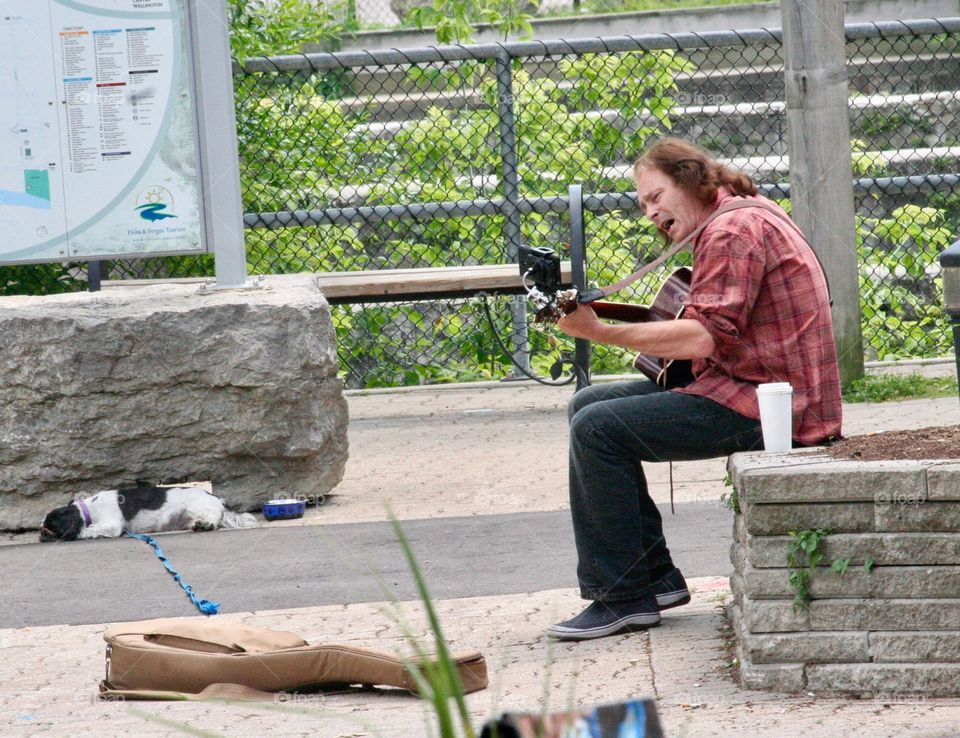 A busker and his dog 