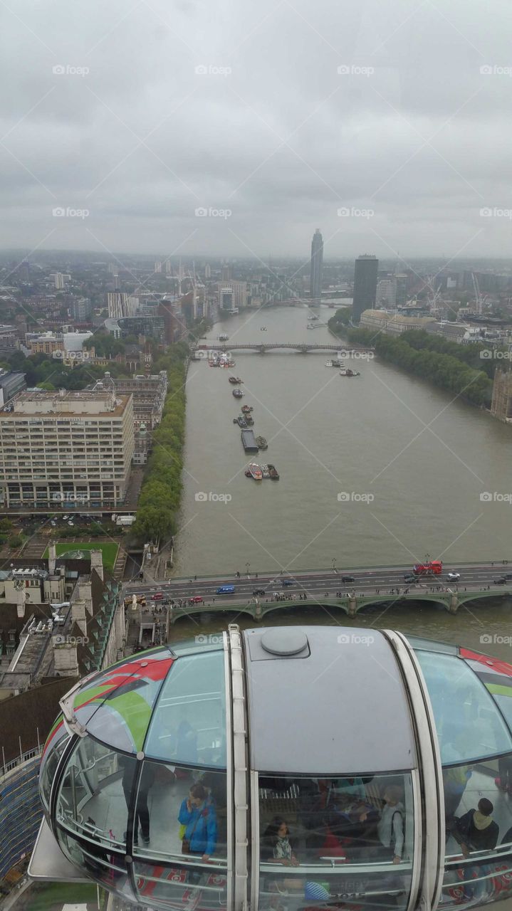 A rainy gray day view of the Thames River from the London Eye