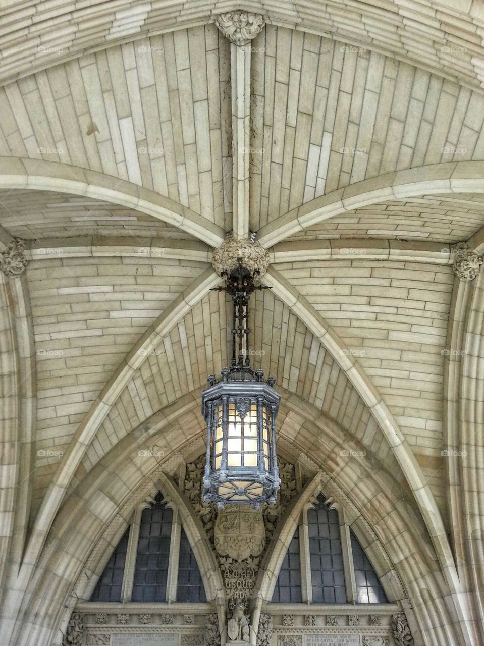 Ceiling of the entrance of the parliament of Ottawa and old wrought iron lamp