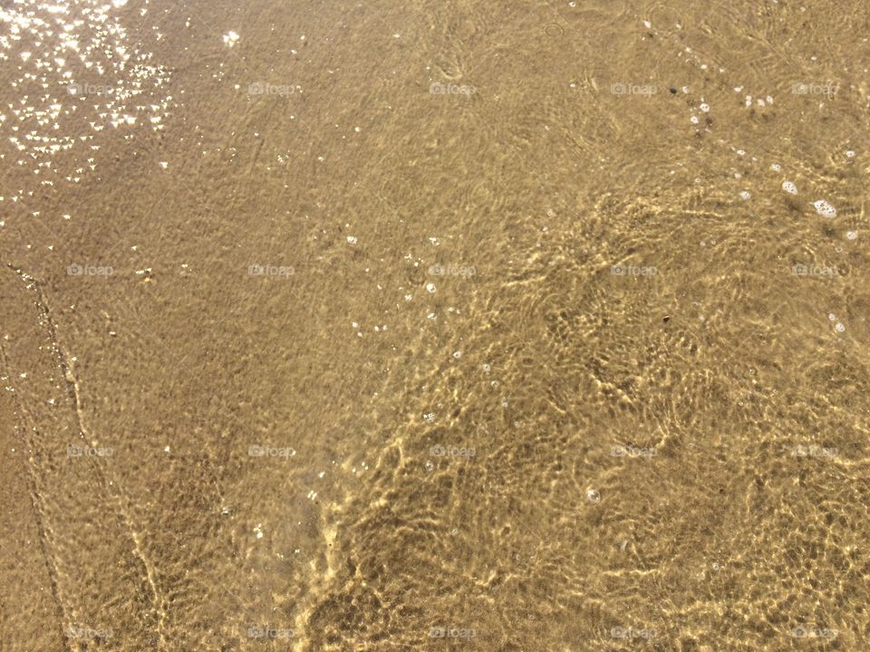 Sand under water lay