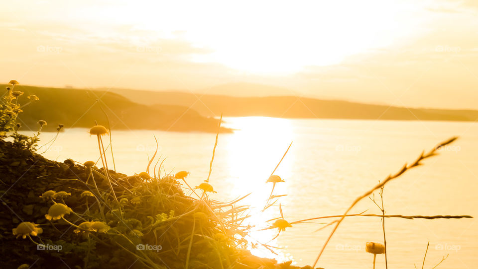 Meet the golden hour from a sea edge