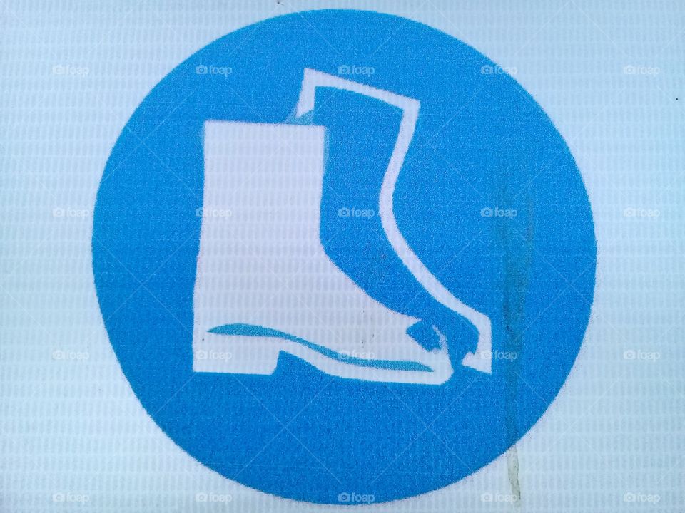 This picture is a warning sign shoes safety