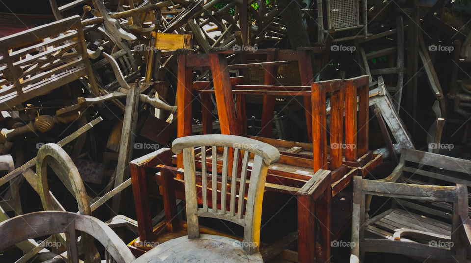 A stack of chairs waiting for their new look