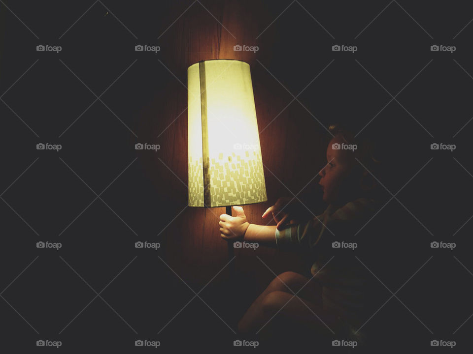 Little Boy Holding Lamp