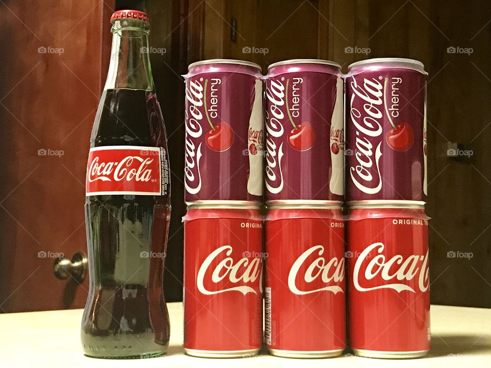 Coca Cola and cherry coke cans and bottle 