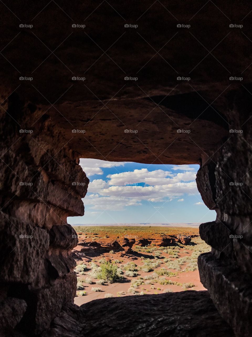 View of Arizona desert through the window of a Pueblo ruin 