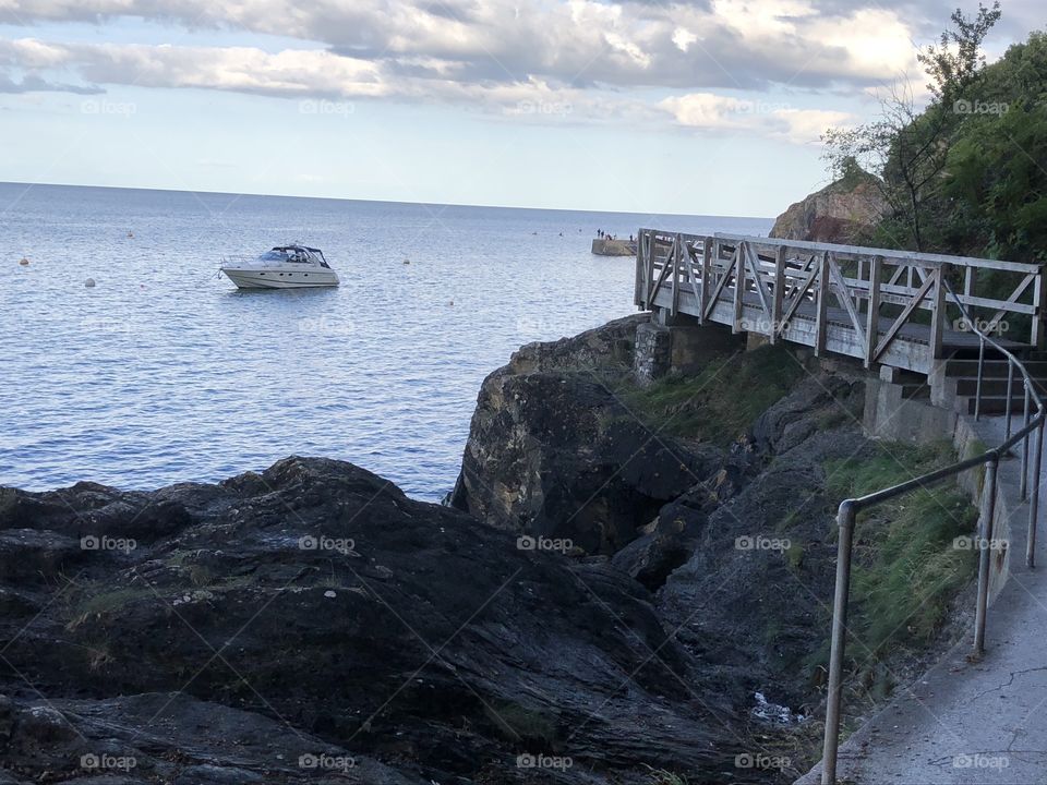 A bridge a small vessel and the position of the two are the main ingredients which set this photo very well on the Torbay coastline.