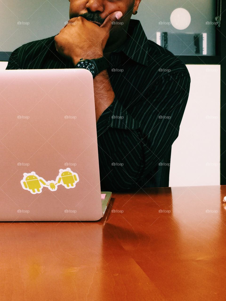 Man working on laptop in office 