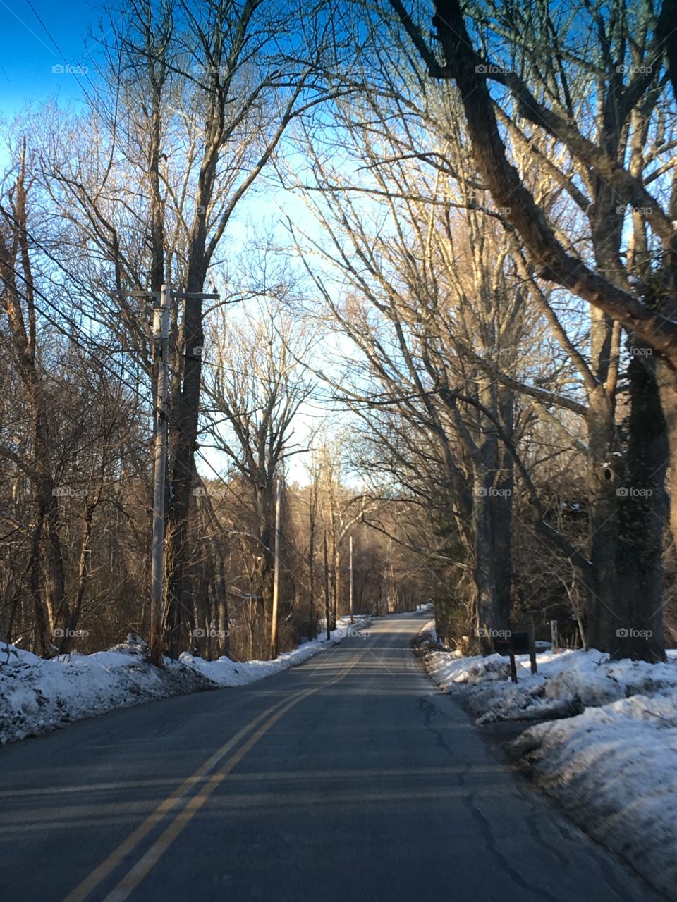 New England Country Road Clear of Snow

Beautiful day out for a ride on the back roads in the Winter. Snow is just in the woods on the sides of the roadways, real pretty but cold!