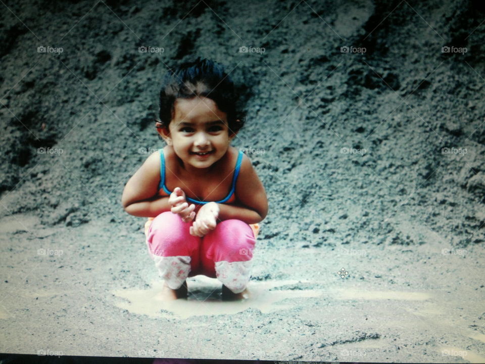 Child playing with mud