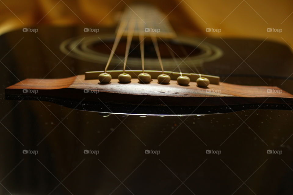 acoustic guitar on Golden textile