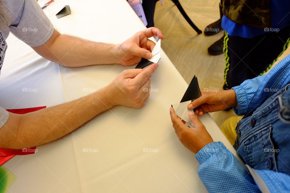 Origami, kid taking paper folding lessons