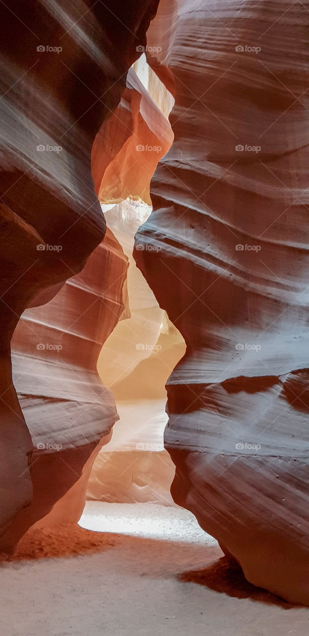 Curves & swirls in the rock caused by years of water flowing through the magnificent Antelope Slot Canyon in Arizona USA