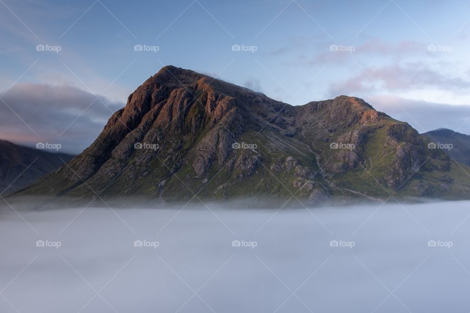 A early morning hike up the side of Stob Beinn A’Chrulaiste with a spectacular view of the mountain Buachaille surrounded by clouds!