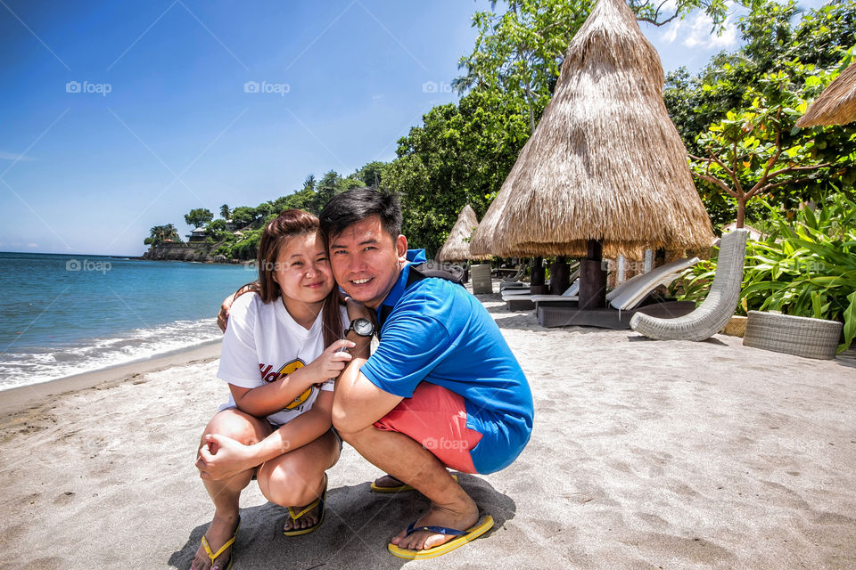 Portrait of a happy young couple on beach