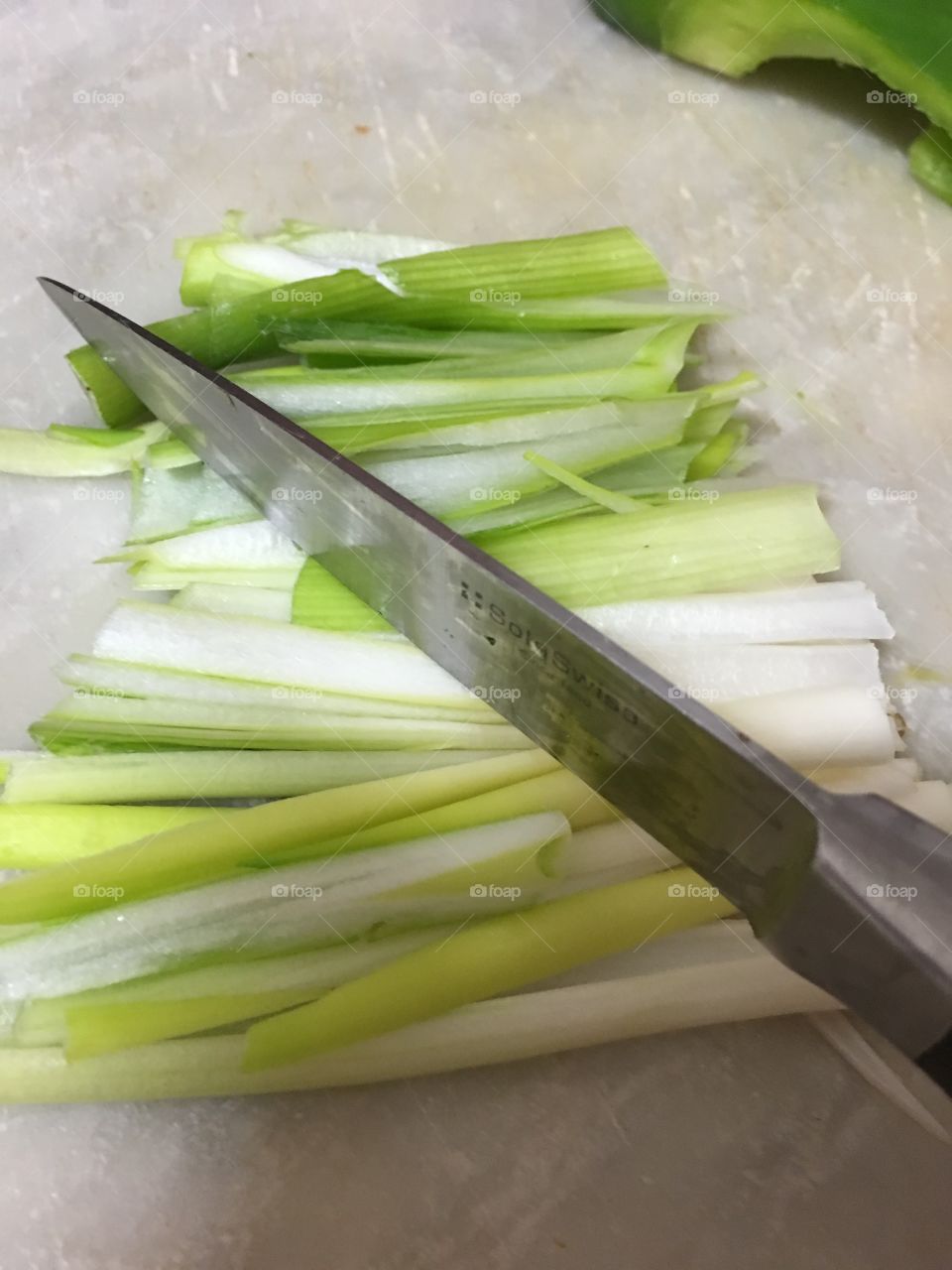 Cutting up green onions scallions for Asian cooking 