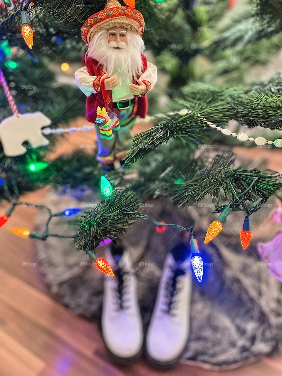 Point of view on Christmas Day, Saint Nick bring Doc Marten boots, gifting Doc Martens, best gift ever, Dr. Marten boots under the Christmas tree, gift of Docs, Docs are the best gift, white Doc Marten boots under the tree, selective focus