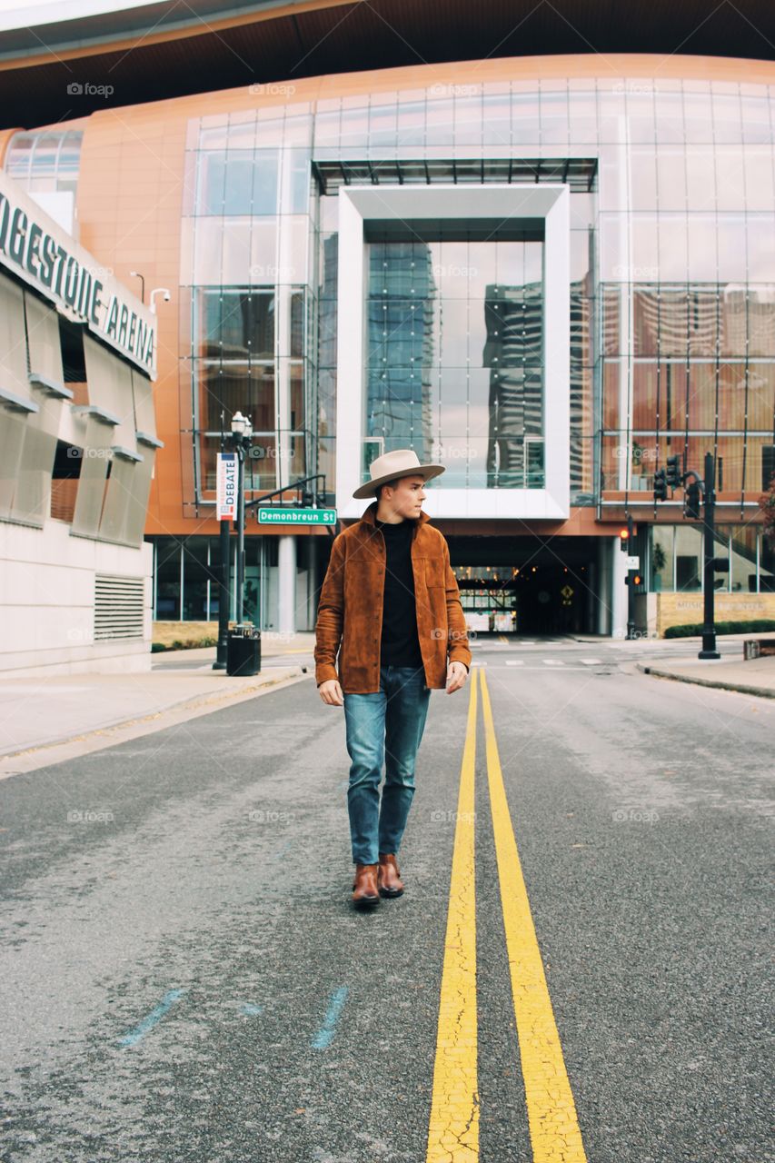 A classy stroll though music city, rusty brown tones complementing each other while buildings reflect upon buildings