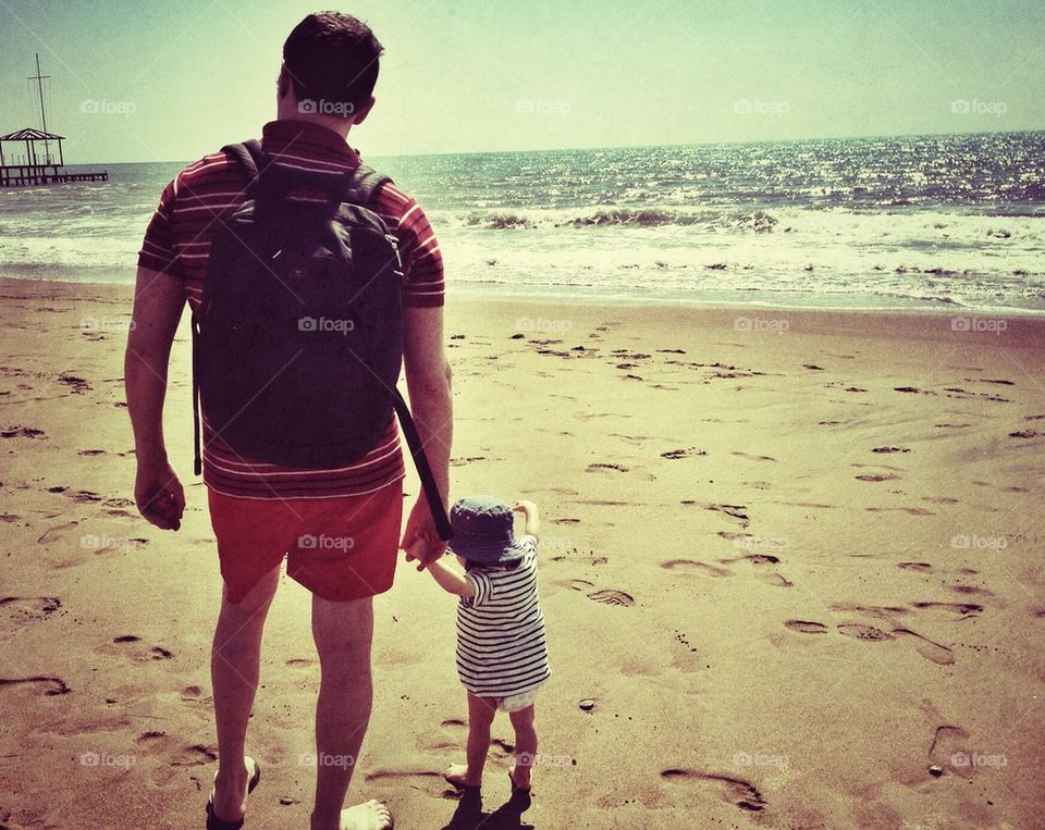 Father and daughter on the beach